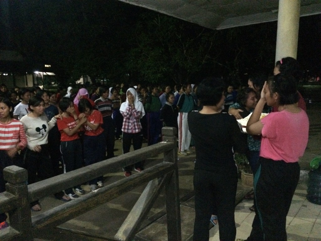 Girls sobbing and comforting each other during Ibu Vera and Ibu Riana's last night "ceremony" (evening rollcall)